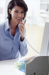 Remote deposit scanner at desk with woman