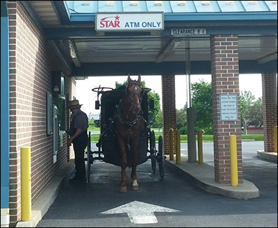 Horse and buggy at drive thru ATM