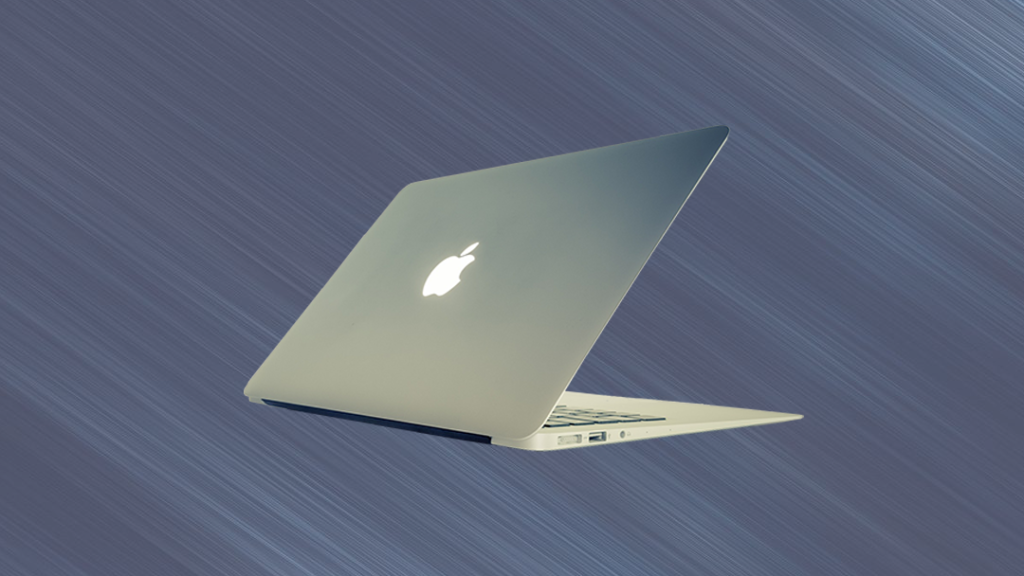 Macbook laptop on blue background.